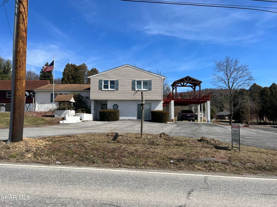 Split level home on approx 0.68 acre a short drive from Prince Gallitzin State Park. This home features 4 bedrooms 2 baths and laundry on the upper level, living room, dining room and kitchen on the middle level.  The lower level has a family room, game room and half bath.  There is a partial basement. Rear covered deck, patio and side carport. There is a detached oversized two car garage, paved driveway and a large storage shed.