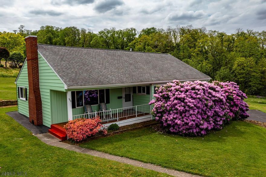 Check out this great one story home in the Williamsburg Area School District! This home features a nice sized living room with a beautiful wood burning fire place an eat-in-kitchen, a mud room which leads to large covered back deck, 3  bedrooms, 1 full bath, and  a large yard with beautiful landscaping on over half an acre .,  A paved drive way leads to an integral garage. Schedule your tour.