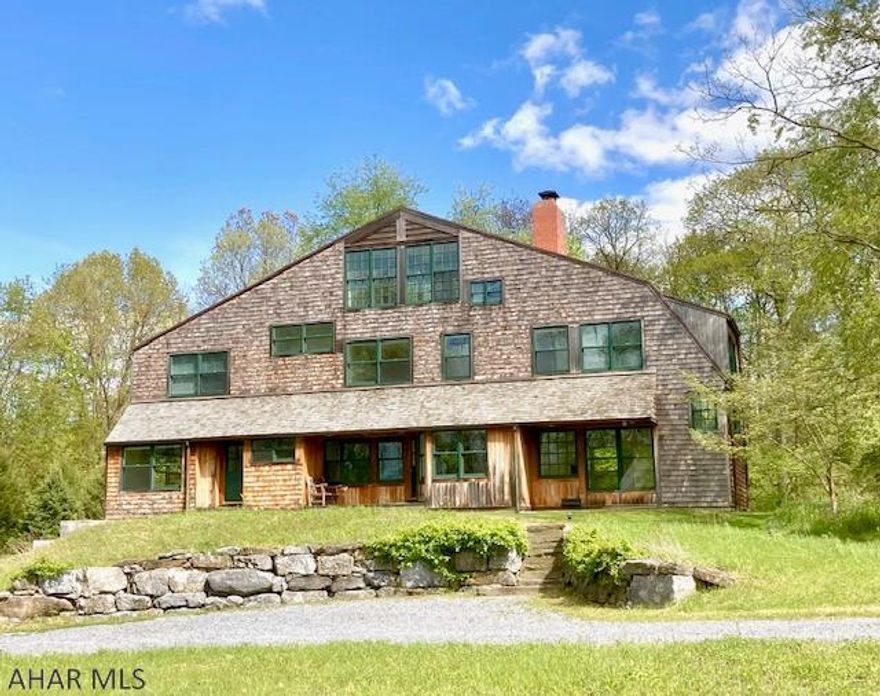 This American shingle style home is nestled in the bucolic setting of the Pantops. It is an exceptionally well built home. Custom designed and built following the principals of Frank Lloyd Wright and Robert Venturi, This home uses lots of natural lighting with an open floor plan to offer a home that is functional and pleasing to the eye. Attention to detail throughout. Hardwood floors (ash), soapstone countertops, tiled showers and a jetted tub, plenty of storage, and multiple built-in features. It has central vacuum and 2-zone natural gas HVAC systems, each with their own humidifier and electronic air cleaner, and an elevator. Wonderfully peaceful and comfortable. The property sits on .91 acres. Adjacent lot is available for the buyers of this property. Must be seen to be appreciated.