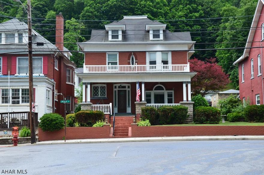 Beautiful brick home in Tyrone borough across from Soldier's Park. This home features 5 nice size bedrooms, wood floors throughout, beautiful original wood work, original stained glass window, beveled glass in entry way, laundry chute in bathroom, off street parking for 6 vehicles, beautiful covered front porch, and covered back patio for entertaining.  This home has been freshly painted inside and out and has so much to offer. Call today to schedule to see this solid brick beauty before it's gone.
