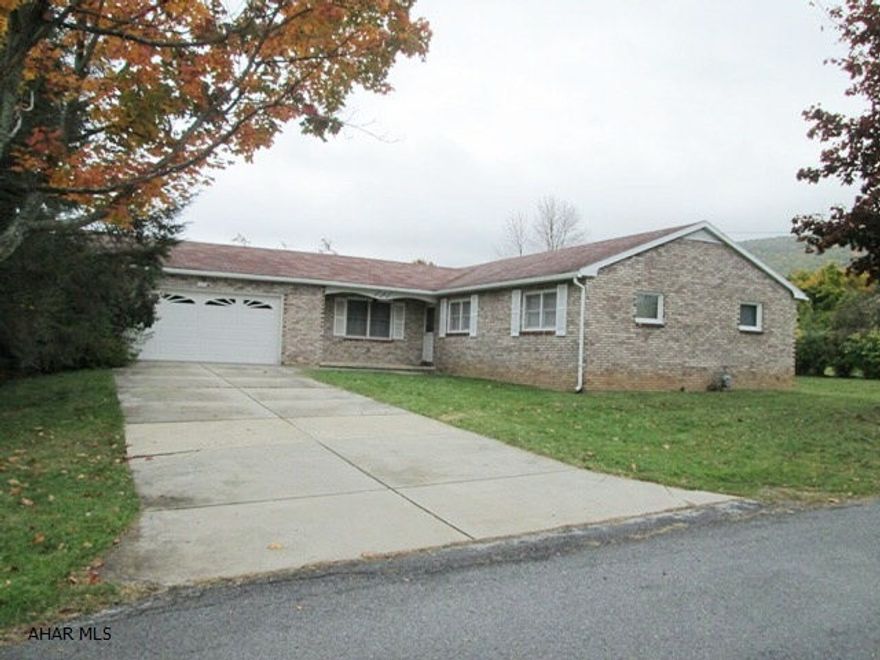 Pleasant Valley - All brick ranch style home on a double lot. The extra lot included in this sale could be separated for another house. The all brick ranch features hardwood floors, eat in kitchen, rear sunroom and large 2 car garage. There is some TLC needed.