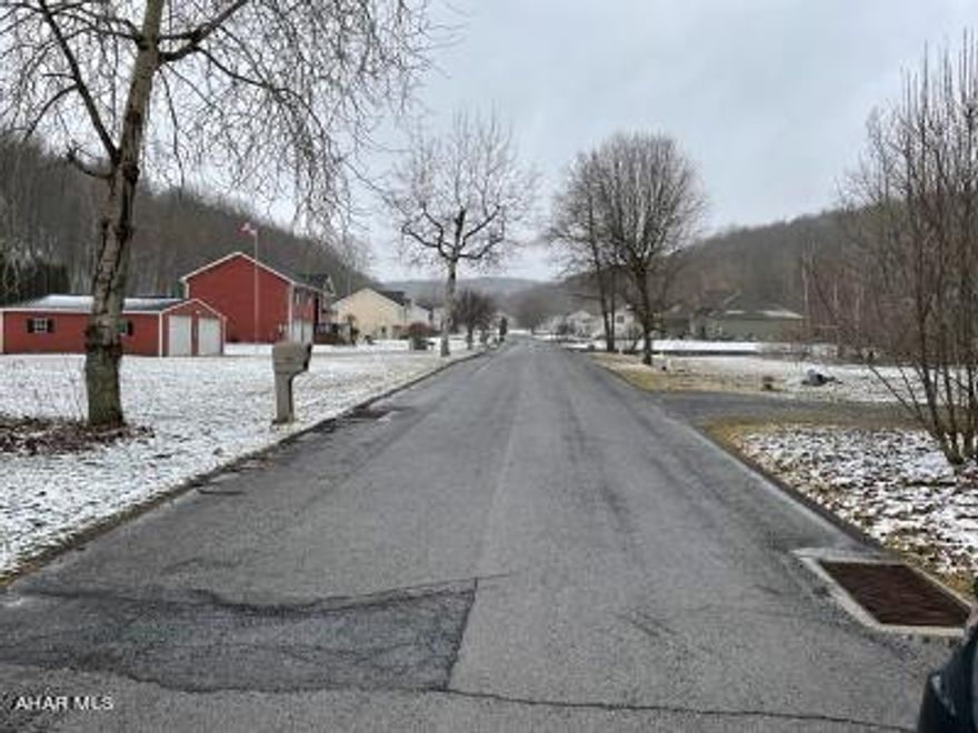 Ideal Homesite. Surveyed vacant double lot in newer development of Brickwood Estates. Public water sewage available. Tap-ins to be purchased by buyer.