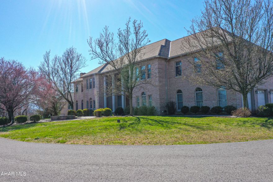 WOW! There is so much to this property!  All brick custom design home located on 4.23 
The interior of the home boasts 5-6 bedrooms, 6 full and 2 half baths, and stunning hardwood and ceramic floors throughout. The formal living and dining rooms are perfect for entertaining, while the bonus (piano) room with a wall of windows is a bright and welcoming space to relax or practice music. The oak woodwork throughout the house showcases exceptional craftsmanship.

The kitchen is equipped with an eat-in nook and leads to a deck overlooking the spectacular view. The master bedroom suite features a large sitting room, fireplace, and master bath.  

The lower level features a living room area with a walk-out to the patio and an in-ground heated pool with optical lighting for relaxation and entertainment. The finished attic with hardwood floors and a ballet bar adds a unique touch of versatility to the property.

To ensure comfort and efficiency, the house is equipped with 4 forced air furnaces.

The incredible views from the property add to the value of this home, offering a serene and picturesque environment.

Don't miss the opportunity to own this exceptional and luxurious property. Schedule a viewing today to experience everything that it has to offer.