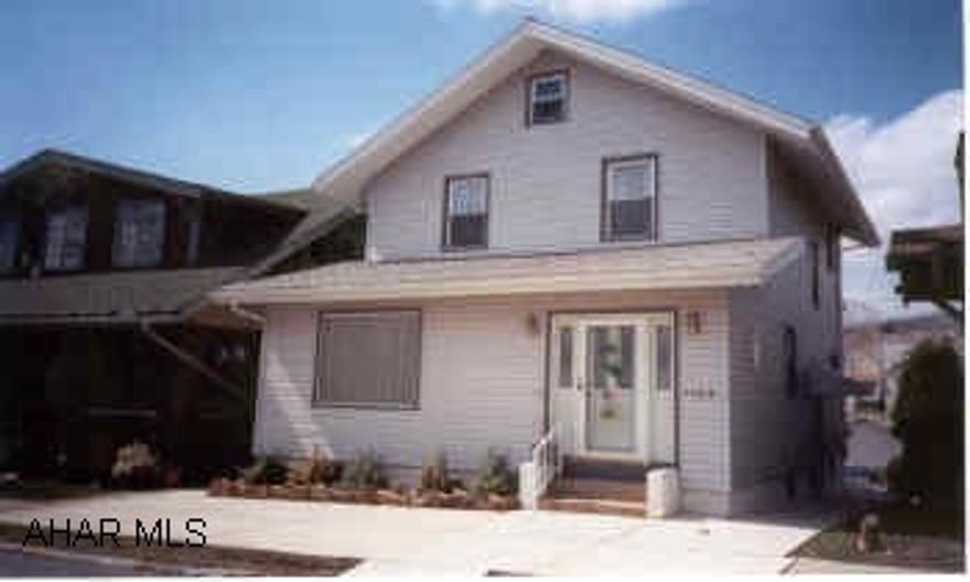 Beige 2 story with new vinyl siding, roof, doors, windows, deck w/electric awning, & sidewalk. Nice livingroom-Wonderful mechanics, needs a little work inside.  Great value w/so much work already done.