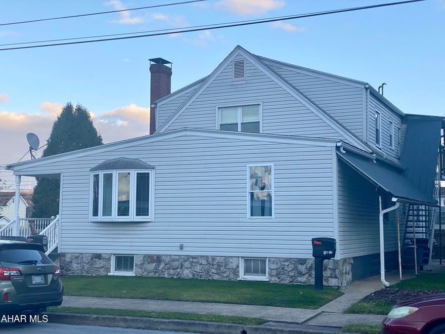 Welcome Home to this beautiful three bedroom, 1 bath home with an additional upstairs apartment, featuring 2 bedrooms for potential rental income. The main home features an updated kitchen, laundry area, 3 bedrooms, living and dining room as well as a new addition to make it your own.  It is situated on a large lot in the village of Smithfield with a large two car garage and loft area.  The yard is fenced in with a privacy fence and has an inviting front and back porch for relaxing.