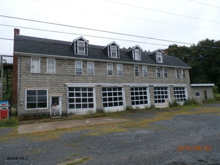 What an opportunity! 5 rental units. 3 Bay Truck Garage. With some work/updating, this could be a real moneymaker. There is a sm. trailer beside the building in need of a complete rehab. 1.8 acres allows room to expand.