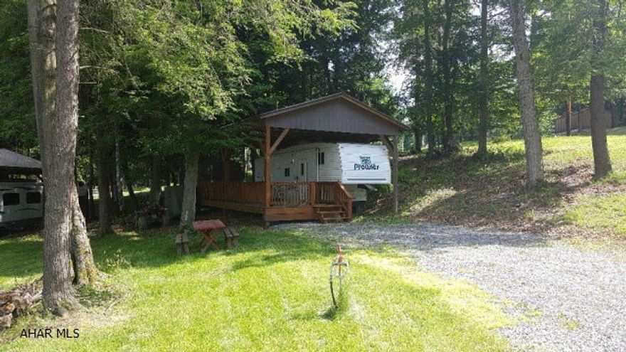 30' 2001 Prowler 5th wheel camper on two lots inside Glendale Yearound. This camper has a double bed and a bunk bed so there's plenty of room for the family. A pavilion and deck protect the camper and give you a nice place to relax. There is also a small shed for storage on the property. Golf cart and patio furniture are included. Glendale Yearound is a gated community minutes from Glendale Lake and Rock Run. Community pool, basketball, tennis, and security.