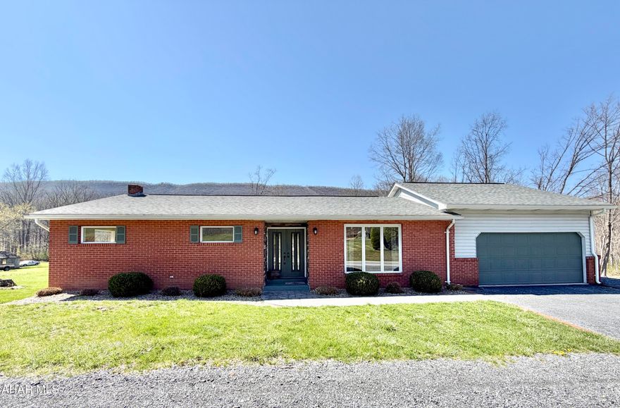 Well-maintained brick ranch home situated on 1.3 acres. The main level features three bedrooms and two bathrooms, along with a comfortable living room, dining room, and kitchen. The full basement includes a laundry area and offers abundant space for storage or future additional rooms. Step outside to relax on the rear deck, ideal for gatherings, while enjoying views of the spacious backyard and mountainside.