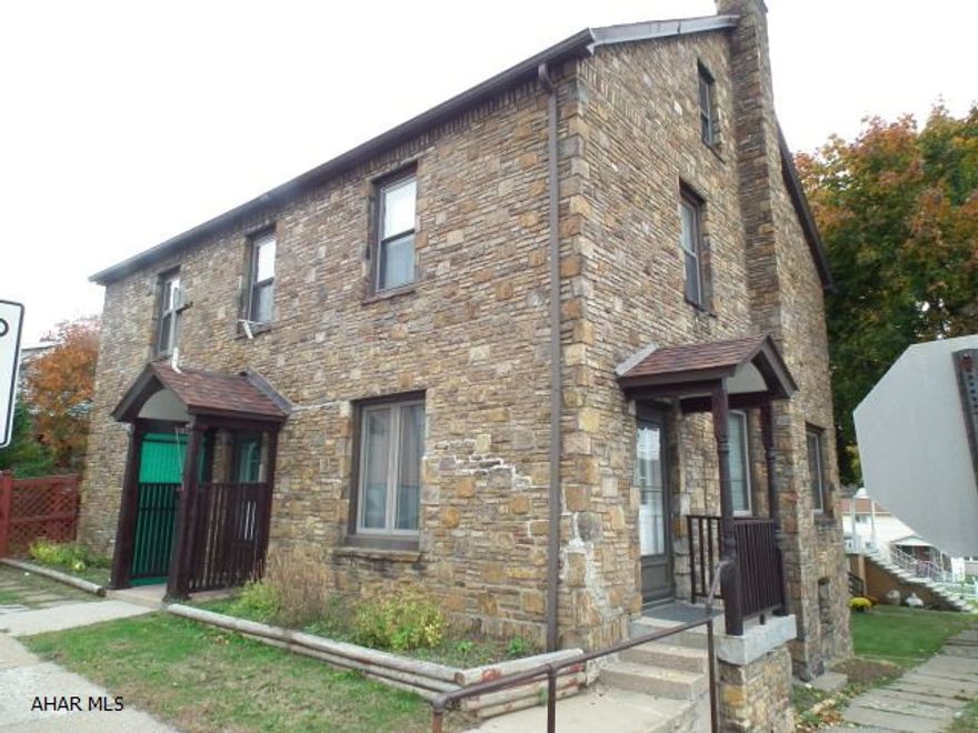 Explore the possibilities! This stone home can offer a great family home with large living room + dining room-built-ins in both rooms. Living room offers fireplace, lg kitchen (needs update), 1st floor laundry with 2 bonus rooms + 1/2 Bath on 1st floor.  2nd floor offers 4 bedrooms and full Bath. All windows have been replaced. 40yr shingles (20yrs old), laundry shoot. Great for group home, office or live-in/office.