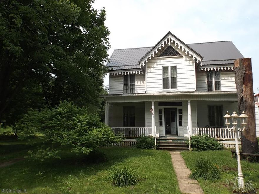 NEW PRICE ----- This 2 story home is not only extremely spacious, but is loaded with Character and Charm - beautiful Hardwood floors, french doors, original woodwork.  Truly a must see!  SIX bedrooms and....  all of the bedrooms are decent sized, and  2 full baths.  One full bath is conveniently located on the 1st floor, as well as the one bedroom  The llaundry room is very spacious (18.5 x 17.2)   There is a  2 -car detached garage (needs roof), and this lovely home is nicely situated on .25 acre of flat ground.  Nothing feels as cozy in the Winter as HOT WATER heat!!!  Great place to raise your family and enjoy some space between the neighboring homes.