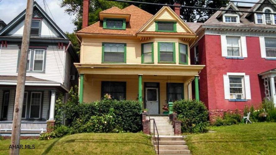 Very charming 6 bedroom, 2 bath, 3 story home. Features include: library shelves w/ladder; decorative fireplace and storage bench in the foyer, gas fireplace in the living room, gorgeous pocket doors, built-ins, high ceilings, heated 3rd floor, beautiful stairway, 1st floor laundry, 1st floor 3/4 bath, private patio, covered front porch, and more.