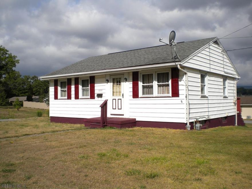 One story home  on a large, flat corner lot in Pleasant Valley. Off street paved parking. 2 bedroom, 1 bath with hardwood floors. Full basement with outside entrance. Newer roof, furnace & hot water tank. House is situated on a 60x120 parcel and there is a 60x120 additional adjoining parcel included in the sale. Lots of space for a garden! Cal me today for your personal tour of this home.