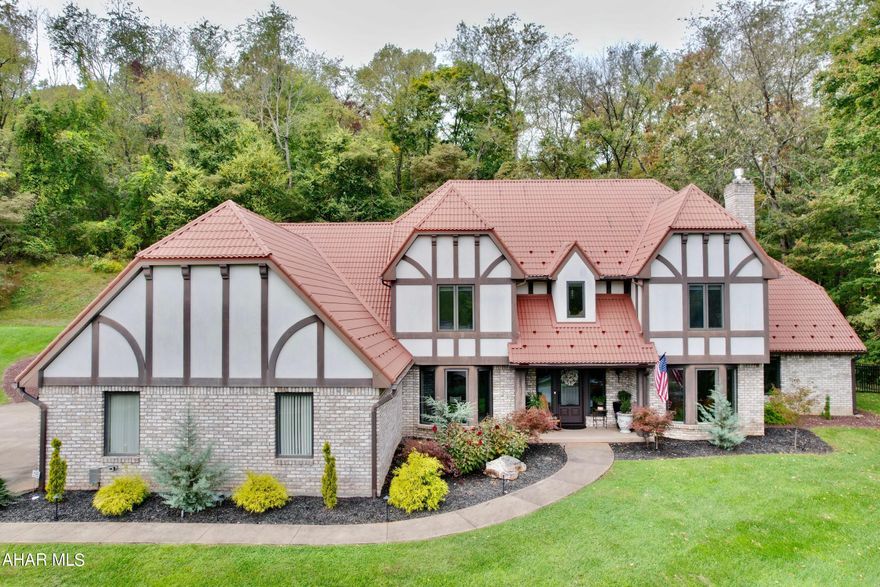 A Beautiful Elizabethan half-timber home in historic Bedford Pa.  This one of a kind home has been completely renovated.  The grand foyer welcomes you with the luxurious staircase.  The breath taking cathedral ceilings and fireplace of the living room will capture your eye.  The wet bar and the patio entrance off the living room are great for entertaining or just a nice evening in the privacy of your own home.  Cozy-up to the fireplace in the den/office.  The custom kitchen offers an island, additional counter space, pantry, and more for all your cooking needs.  A bright and cheery breakfast nook over looks the private backyard and patio.  The kitchen flows nicely into the formal dining room.  The large first floor master suite offers 2 walk-in closets, master bathroom with a soaking tub and tile shower.  The large windows in the master suite overlook the wooded backyard.  As you walk up the grand staircase to the second floor, the staircase becomes a cat-walk overlooking the living room cathedral ceiling and is sure to impress.  The second floor has 3 large bedrooms and 2 full baths offering privacy to family and guests.  Lets not forget the professionally manicured yard and 3 car garage.  This home has so much to offer, words can't fully express the beauty in this home.  Schedule a private tour today.