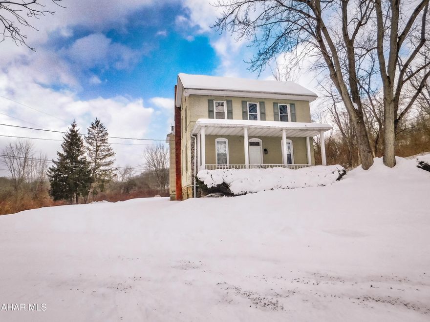 Tucked away in a private, peaceful setting within the Bellwood-Antis School District, this classic old farmhouse is full of country charm mixed with simple comforts.
The main floor is functional and spacious with two spacious living rooms and the convenience of main floor laundry.  The dining room is equipped with a pellet stove adding a cozy warmth and can even be used as the main heat source which is absolutely perfect for chilly evenings and a true farmhouse feel.
The second floor is complete with four bedrooms and 1.5 bathrooms.  The main bathroom is stunning offering a custom tile shower surround with a built-in ledge blending a handcrafted style with everyday function.
With the quiet surroundings and open space, this modern farmhouse delivers the tranquility of country living while remaining connected to a strong school district and community.