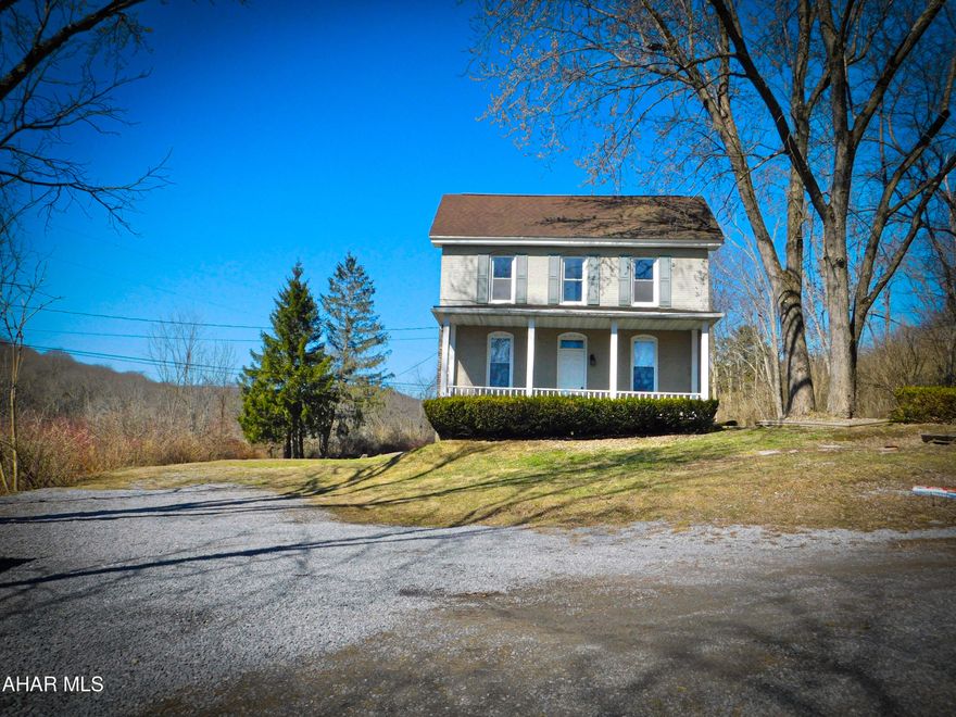 Tucked away in a private, peaceful setting within the Bellwood-Antis School District, this classic old farmhouse is full of country charm mixed with simple comforts.
The main floor is functional and spacious with two spacious living rooms and the convenience of main floor laundry.  The dining room is equipped with a pellet stove adding a cozy warmth and can even be used as the main heat source which is absolutely perfect for chilly evenings and a true farmhouse feel.
The second floor is complete with four bedrooms and 1.5 bathrooms.  The main bathroom is stunning offering a custom tile shower surround with a built-in ledge blending a handcrafted style with everyday function.
With the quiet surroundings and open space, this modern farmhouse delivers the tranquility of country living while remaining connected to a strong school district and community.