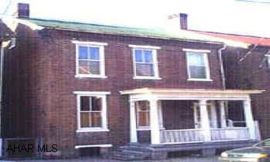 This property features all the good qualities of an older home.  Two story brick home with large rooms, high ceiligs, transom wondows, hardwood floors.  Enormous kitchen, furnace is new.