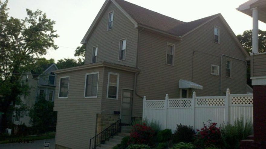 This home offers lots of room . Is now being used as a single family home, but can be a duplex. there is a kitchen on the 2nd. floor. The 1st floor has a master bedroom suite with plenty of closet space. The 2nd floor has 3 bedrooms..full bath and kitchen area. If used as duplex there is seperate entrance. Detached oversized 2 car garage with off street parking. Yard is private and fenced.