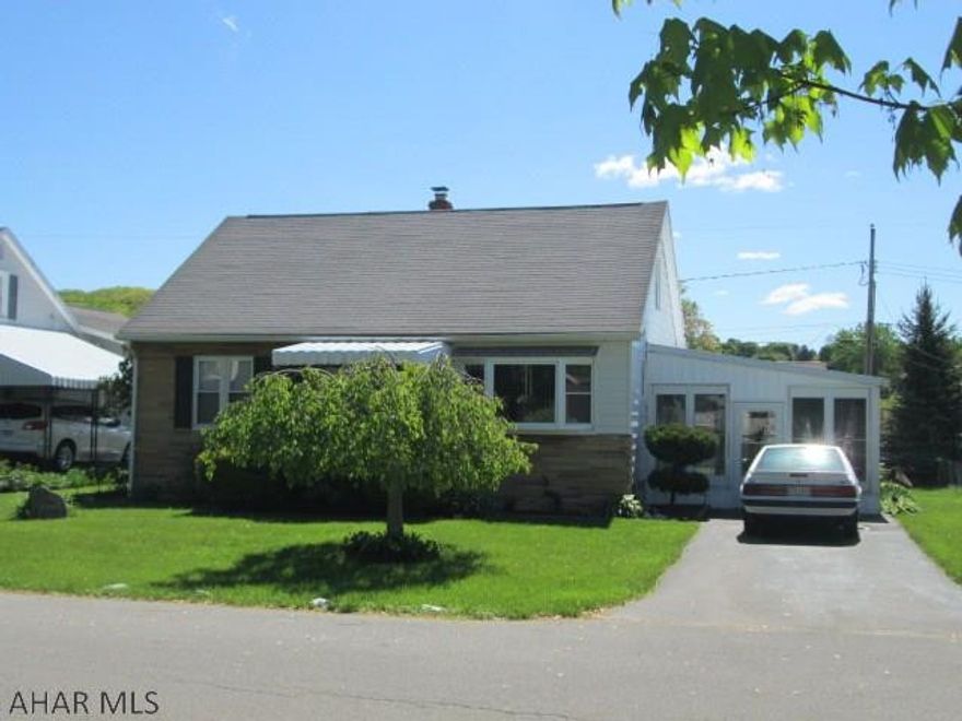 Eldorado. Cute Cape Cod with 2 first floor bedrooms. Kitchen has been updated with tile floors & counters. Appliances included. The second level features large room with walk in closet. The sun room off the kitchen has a hot tub that is included. There's more, the lower level is finished with bar area, family room, office space, large shower and laundry room. House has hardwood floors that are currently all covered.