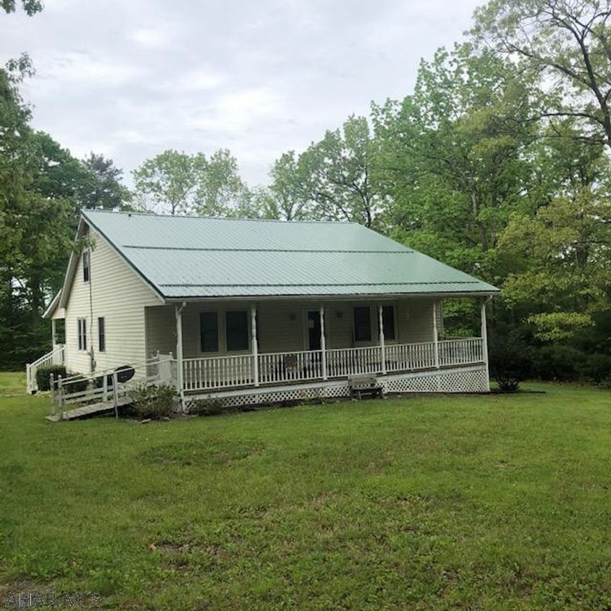 Take a look at this lovely 1.5 story home nestled on a nice acre lot in the Breezewood Park subdivision. Walk in to an all-season sunroom with a fabulous adjoining screened porch. French doors from the sunporch open directly in to the family room and open concept spacious kitchen. First floor laundry and half bath are conveniently located. Hardwood floors throughout parts of the home add to its charm and extend in to the living room with bay window and continue to flow in to the spacious first floor owner's suite with a bay window and large en suite 3/4 bath. The second floor has a huge bedroom and dressing room with a full bath of it's own. The 2nd floor attic storage is a huge bonus along with the 1 car garage and shed with electric. This home is being sold "As is/Where is".