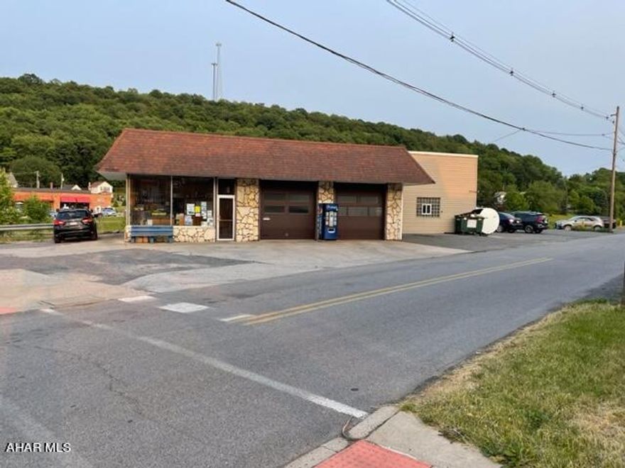 Well established business on ideal main street corner lot. ''Turn Key'' for building and business Vehicle service and repair.Includes 30'x28' 2 bay garage with 2 (10'x10')overhead garage doors with remote , store front, office , storage room, utility room and 2nd floor for tire storage.