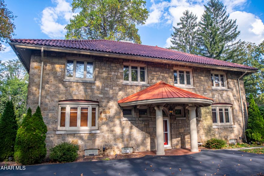 A distinguished Italian Renaissance Revival residence, this home seamlessly blends timeless architecture with refined modern comforts. Step inside to discover two gracious living rooms, each anchored by its own fireplace, and a chef's kitchen appointed with a Sub-Zero Pro refrigerator and freezer, Viking range, island sink, trash compactor, and exquisite cabinetry.

The second floor hosts four bedrooms, including a luxurious owner's suite featuring a walk-in closet, oversized tiled shower, and heated floors. A private en-suite bedroom, an additional full bath, and a large laundry room complete this level. The finished attic and basement provide versatile living, storage, and entertaining spaces.

Set on nearly an acre, the property includes a three-car garage, existing pool hookups, and a first-floor balcony. Designed with both elegance and efficiency in mind, this exceptional residence offers a rare opportunity to own a piece of architectural history, beautifully updated for today's lifestyle.