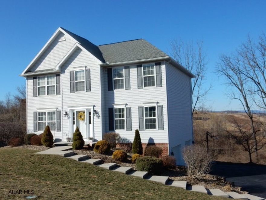 A great open floor plan with modern color choices and plenty of storage.  Oak kitchen with pantry , recessed lighting,pullout shelving and a moveable kitchen island all overlook the family room with marble fireplace and wooded views from the rear deck. The master suite is spacious with a WIC AND 2 additional closets.  Master bath has double sinks with a garden tub and walk in shower. All stainless kitchen appliances are included and this home has an ADT security system, electronic dog fencing and Radon system already in place.  This home is located in a wonderful neighborhood, within the Hollidaysburg School district.  A basement bonus room could be finished to your liking.  New hot water tank, installed 5-27-2015.