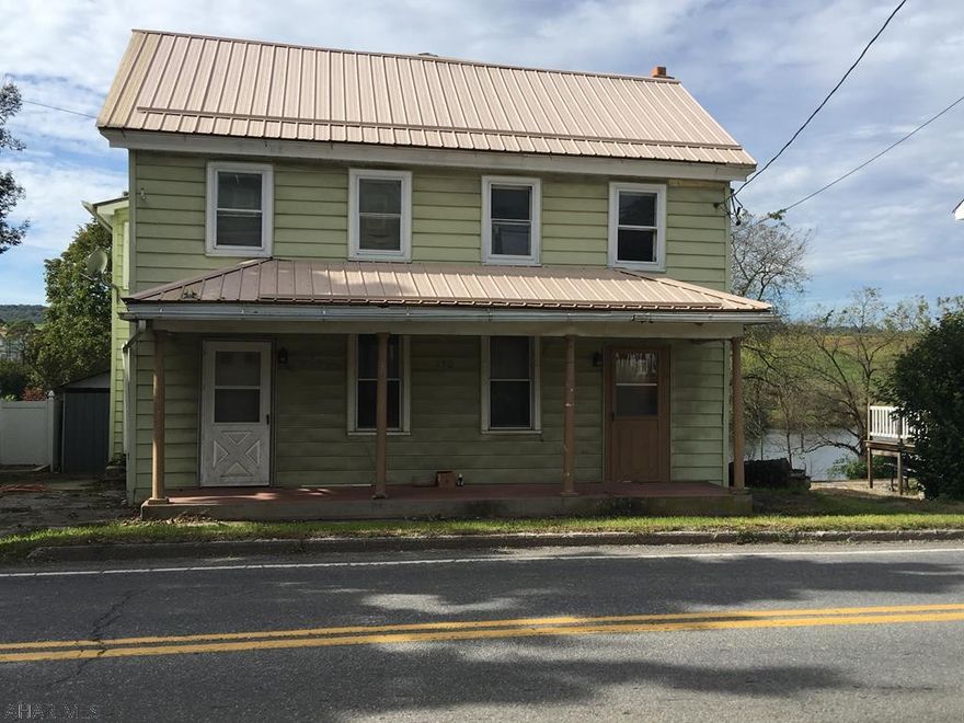 Residential or Rental property!  Great fixer upper with lots of potential!!  Make this your residence or can  be made into 2 income producer rental apts.  The home has a newer metal roof.  With a vision and some TLC endless possibilities!!