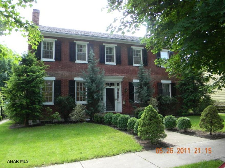 Stately all brick federal home situated in the Historic Bedford Borough.  Fabulous period details including original pine board floors, door and window casings, hand made wood interior doors, multiple-fireplaces and original hand made staircase.  First floor has an entry foyer, living room w/ fireplace, dining room, kitchen w/ fireplace, family room w/ fireplace and wet bar, rec. room, laundry room and half bathroom.  The second level offers five bedrooms, four w/ fireplaces, two-full bathrooms and a storage room.  Walk-up attic and stone foundation.  Former servant quarters w/ wood fireplace and smokehouse that has been rehabbed and used as guest quarters or studio/office space.  Mature landscaping, garage, double-story porch and stone patio.  Gas hot water heat and 200-amp electric.