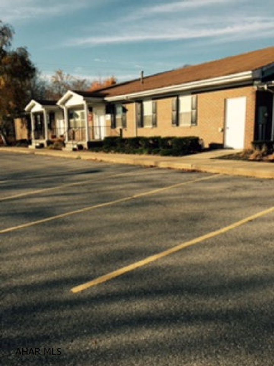 Professional office building. Currently leased to attorneys. Loads of parking, front and back.  Handicap parking and entry in rear.  Great investment opportunity. Possible installment finance.  Apprx. 10,000 square feet over all; 3900 on finished lower level.  Great buy  You do the math $64.00 per square ft.