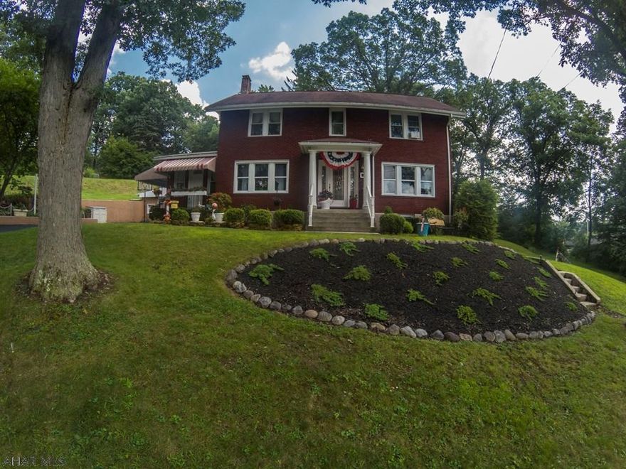 Distinctive Colonial in the heart of Lakemont.  Welcome home to this two story brick home featuring 3 large bedrooms, 3 bathrooms, large beautiful kitchen with high end Samsung stainless appliances, stunning foyer w/porcelain floors, hardwood floors, 1st floor laundry, two gas fireplaces, beautiful living room with crown molding, lovely original woodwork, all on a private setting.   This home also features a detached garage with separate workshop, shed, covered patio, high efficiency Bosch boiler that provides low heating cost, and completely updated electrical wiring.           Listing agent related to seller.