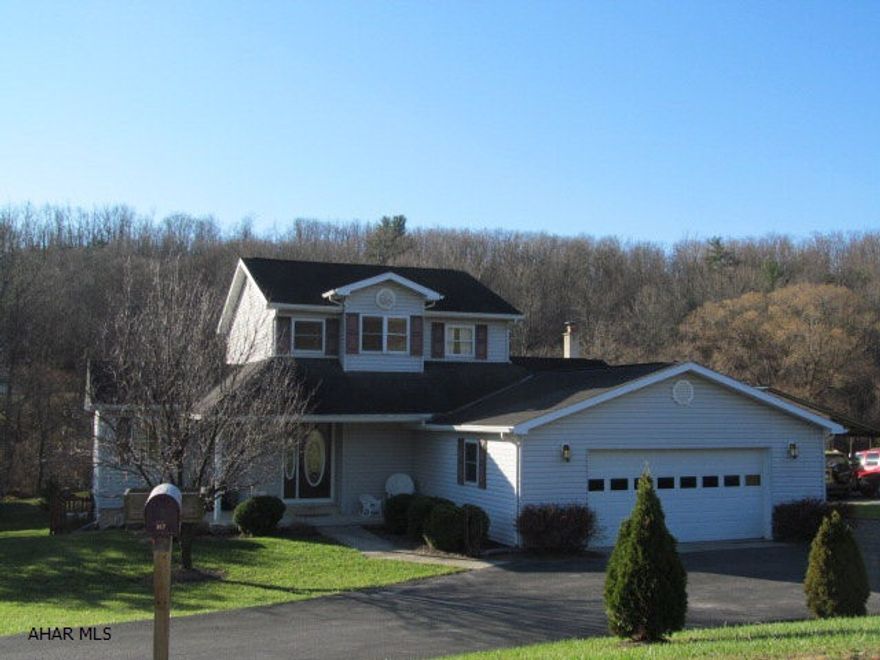 Immaculate, move-in ready home on a beautiful 1/2 acre setting.  Features include updated kitchen with quartz countertops & ceramic tile floor, 1st floor master w/bath, 1st floor laundry, and oak trim and solid oak 6-panel doors throughout.  2-story foyer leads to additional 2 BR's and full bath on 2nd floor.  Partially finished basement w/woodburner and 2-car garage.  Reverse osmosis and chlorination system are an added feature.  Convenient location centrally located between Altoona, State College, & Huntingdon. Take a look, you won't be disappointed.