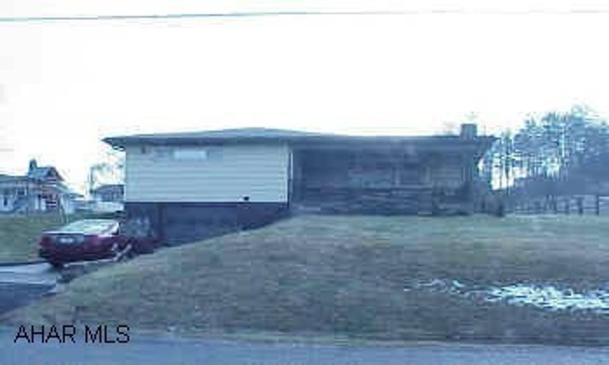Very nice ranch on a landscaped lot, screened-in back porch.  Woodburner insert in living room fireplace
