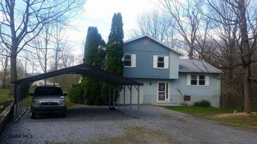 MOTIVATED SELLER!!!!! GREAT home in Spring Cove School District on 1.25 acres on private lane. HUGE fenced in backyard with detached 2 car garage. Master bedroom with a half bath. Home also features a 1 car integral garage with separate carport, heat/ac pump unit in living room and eat in kitchen. Large covered back deck. Could finish the basement for another entertaining area. Call for your showing today!