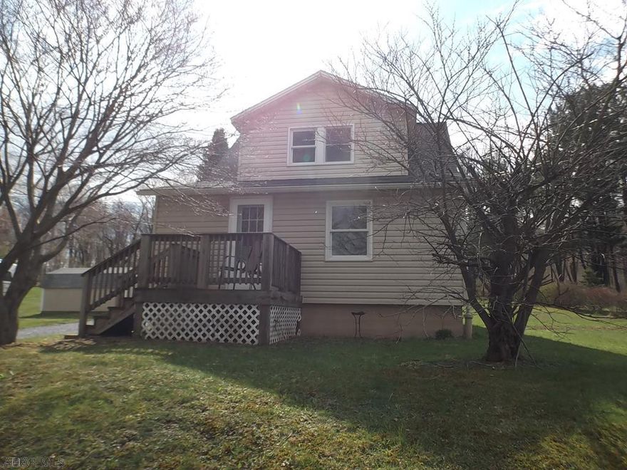 Cute & Cozy in the Country! Great Starter Home. All  rooms freshly painted. Newer windows & siding (previous 2011).  Central Air installed 2013.  New Well drilled 2018.   Lots of room to play on the acre lot that backs up to woods, watch the deer from the covered deck. The hardwood flooring does need refreshed.  The property is just minutes from Frankstown Elementary, Rt 36 & Rt 22.