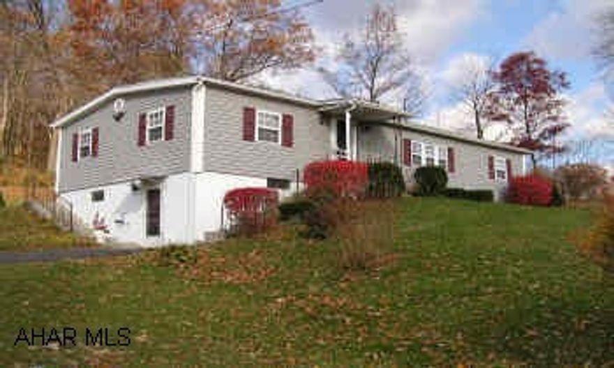 Handsone up-dated ranch type, 3BR/1.5BA with view on 2.7 acres. 2 car two story heated garage. Newer roof, siding. Large up-dated kitchen, central air, walkout basement with kitchenette, covered patio. Energy efficient thermo pane windose, bright sunroom.