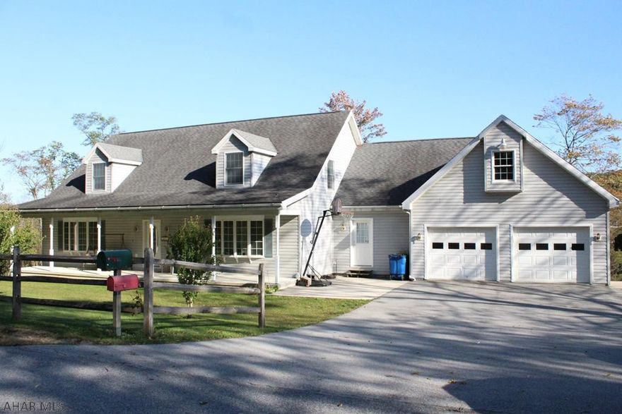 Beautiful 5 bedroom, 3 1/2 bath cape cod on 23+ acres.  Kitchen features cherry cabinets, double oven, Jenn Air gas stove, and granite countertops.  Main floor master suite.  First floor laundry.   Gorgeous sunroom with mountain views.  Unfinished basement with 10' ceilings.  Hookup ready for outdoor furnace.  Attached 2 car garage and integral garage.  Hunting paradise with trails and stream.
