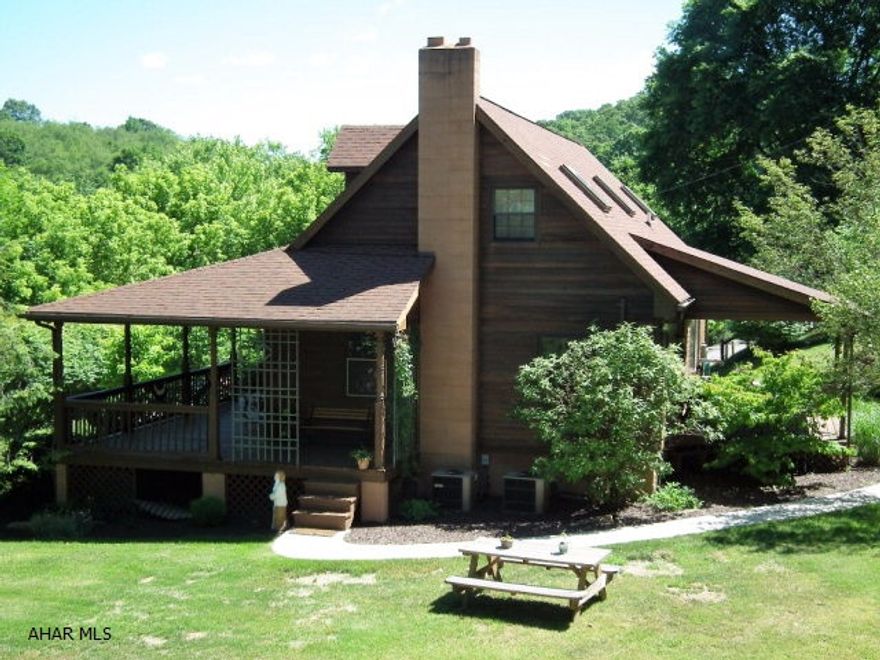 1 1/2 Cedar home surrounded by nature on 2.9 acres! Wrap around porch, covered deck in back, recently remodeled kitchen, large master suite second floor, 1 bedroom 1st floor, total 3 bedrooms, two full baths, W/I closets, a picturesque setting.