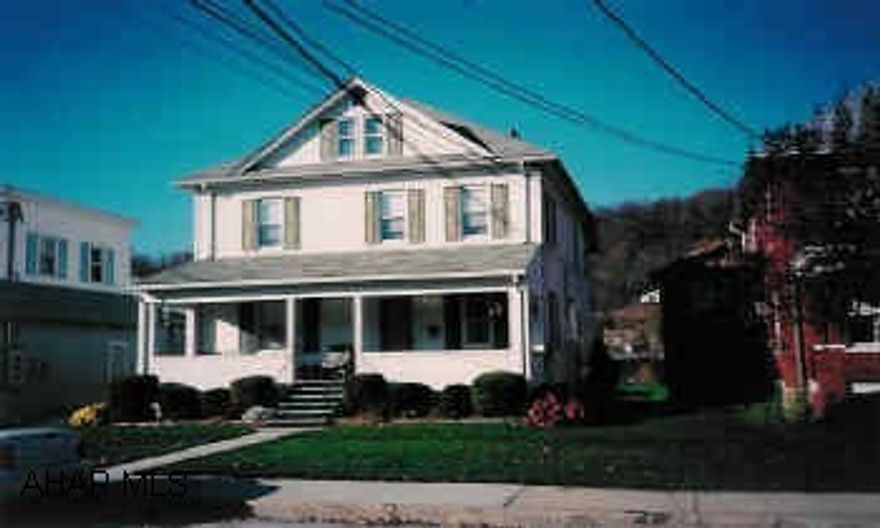 Lovely 2-story, in town location, modern kitchen w/oak cabinets, formal living and dining room w/pocket doors, original woodwork throughout. Front porch, rear deck, borders Raystown Branch of Juniata at rear.