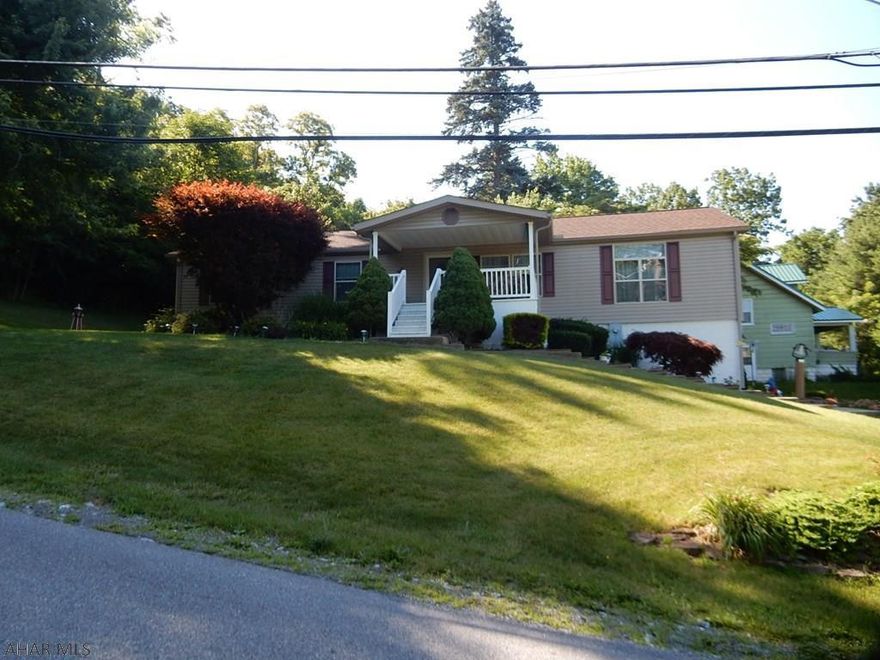 BACK ON THE MARKET - NO PROBLEMS WITH PROPERTY - BUYERS CHANGED THEIR MIND. PRICED REDUCED: 
Very Nice, Well Kept home with so much gross living area for a home in this price range.  Check out this Doublewide with a full basement located on Forrest Street in Lakemont.  Step Down Living Room, Family Room, Dining Room & Kitchen provides a larger vaulted ceiling. Recently remodeled master bathroom with walk in shower. Home features 3 Bedrooms 2 baths, living room, dining room, family room, laundry. Basement feature 2 car integral garage with framed in area for recreation room, lots of built-in storage, large ceiling height and possible area for finished bathroom.  Title is retired and home is considered to be real estate.  Nice mountain view.