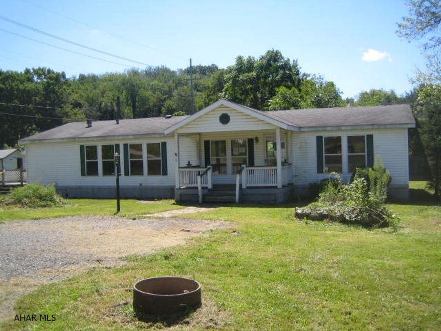 Nice double-wide in Tyrone.  Large eat-in kitchen with island, master suite with hot tub.  Large deck and shed.  Needs some TLC, but could be your perfect home. Property sold AS-IS. Seller will make no repairs. Buyer pays both transfer taxes. Equal Housing Opportunity. Property is uninsurable because of plumbing failure.