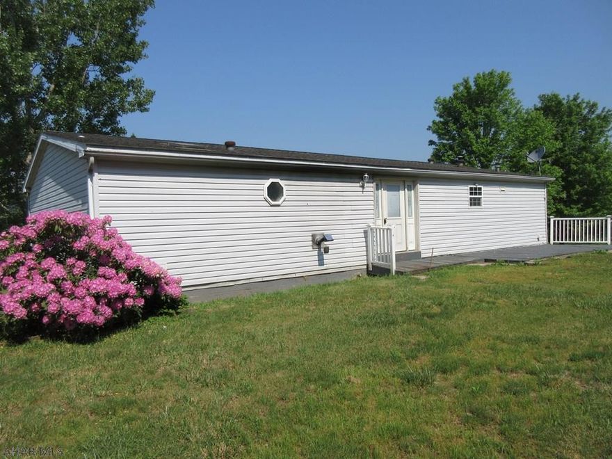 Fishertown area spacious double-wide home in private location with permanent foundation. Features large living room, eat-in kitchen, 3 bedrooms and 2 baths includes ensuite with whirlpool tub, stand-up shower and walk-in closets. First floor laundry, 2 car integral garage, large rear deck, storage shed and pavilion. Property sold AS-IS. Seller will make no repairs. Offers must be submitted through HUD approved broker. Buyer pays both transfer taxes. Equal Housing Opportunity.