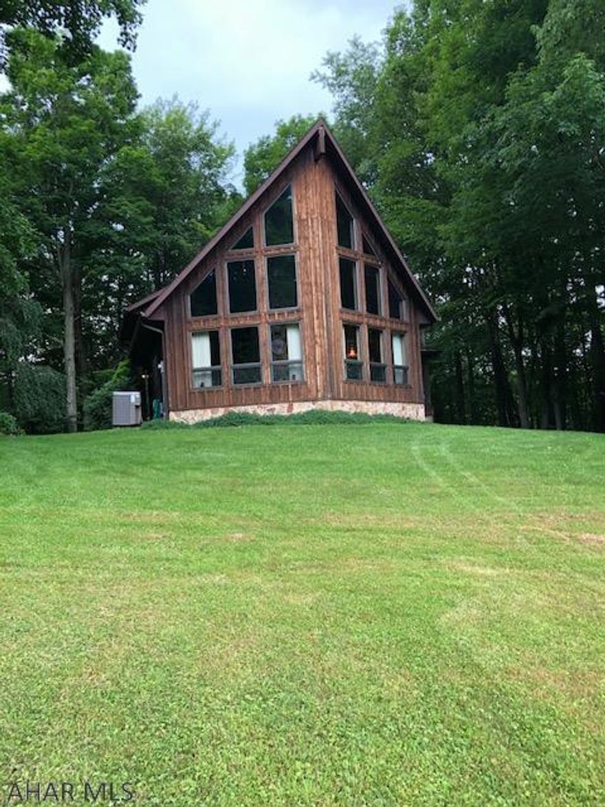 Absolutely beautiful home on 18 acres bordering both sides of Evitts Creek.  This 3 bedroom, 2 full bath home has large rooms, sitting room in master bedroom along with a private deck, granite countertops in kitchen, beautiful views from the large windows, large basement, carport, shed and large yard and large amount of wooded acreage.  Might even get the nightly visit from the neighboring peacock.  Gorgeous property!!!!