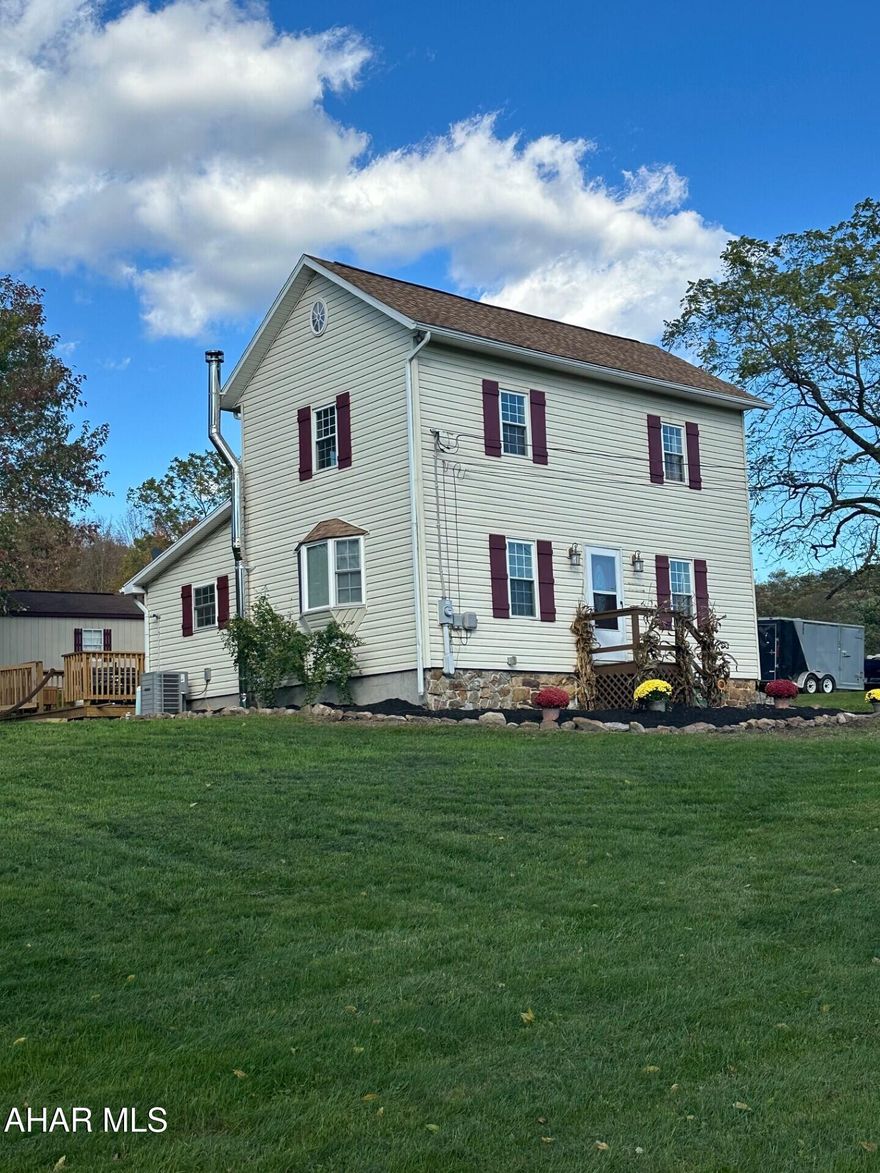 This lovely 3 bedroom home in Chestnut Ridge School District has been lovingly maintained.  New upgrades include roof in 2018, well pump in 2022, new carpet 2024, and a new heat pump in 2024.  One main floor bedroom along with a full bath and laundry room allow for one floor living.  The generous eat-in kitchen flows right into the living room, allowing for that openness we are all looking for.  In addition to the charming inside living space, this home offers outside living spaces as well with a beautiful fire pit area, a new deck and large gently sloping yard.  This one screams country charm!