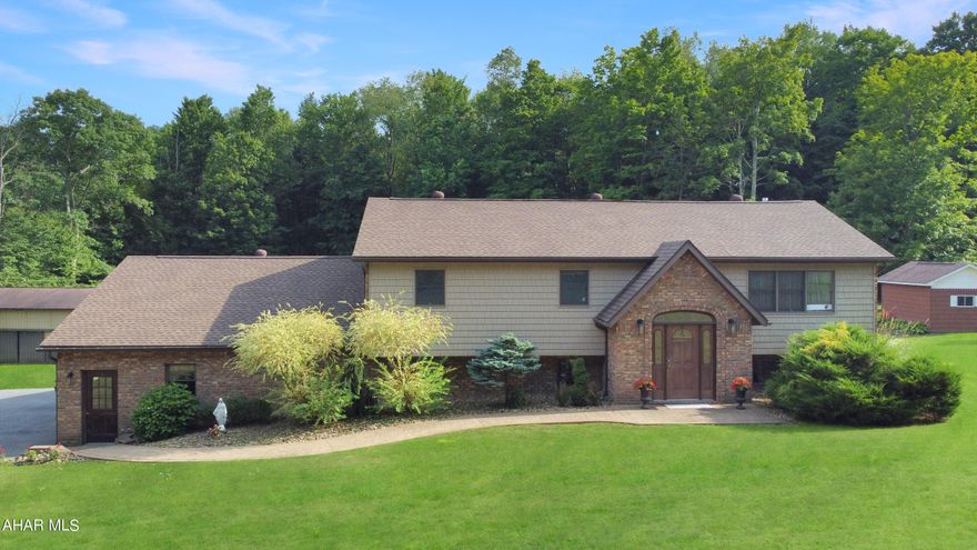 Welcome to 671 Whiskey Springs Road, nestled in the Forest Hills School District. This impressive residence, constructed in 1997, is set on a spacious one-acre lot and has been lovingly maintained over the years. As you step inside, you are welcomed by an inviting open floor plan that boasts soaring cathedral ceilings throughout the living areas. The main floor features a grand foyer, a cozy living room complete w/ a gas fireplace, a charming dining area, & a custom kitchen equipped w/ included appliances. The master suite is a true retreat, offering an en suite full bathroom & an enormous walk-in closet. Two additional well-sized bedrooms & another full bath complete this level, all adorned w/ elegant hardwood floors. The lower level of the home showcases a beautifully finished living area, enhanced by a second gas fireplace, a dedicated laundry space, & potential for a third full bathroom. There is also plenty of room for storage or the opportunity to further customize the entire basement to suit your needs. Outside, the property continues to impress w/ an oversized attached three-car heated garage, a versatile detached pole building, & a playhouse w/ electricity. Enjoy summer days in the above-ground pool, surrounded by fencing & vibrant landscaping. With so many exceptional features, this home truly has it all. Call today for your private tour!