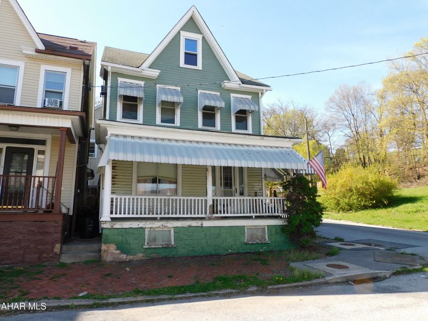 This home would make a great investment property! First floor is very spacious with a 1/2 bath. 2 bedrooms and a full bath on the second floor.. Large primary bedroom that could be made into separate bedrooms. Finished attic for storage or a 3rd bedroom. Property needs some TLC. There are 4 additional parcels of land across 10th Street that are included in the sale of this property. Parcels are Approximately .15 Acres total.