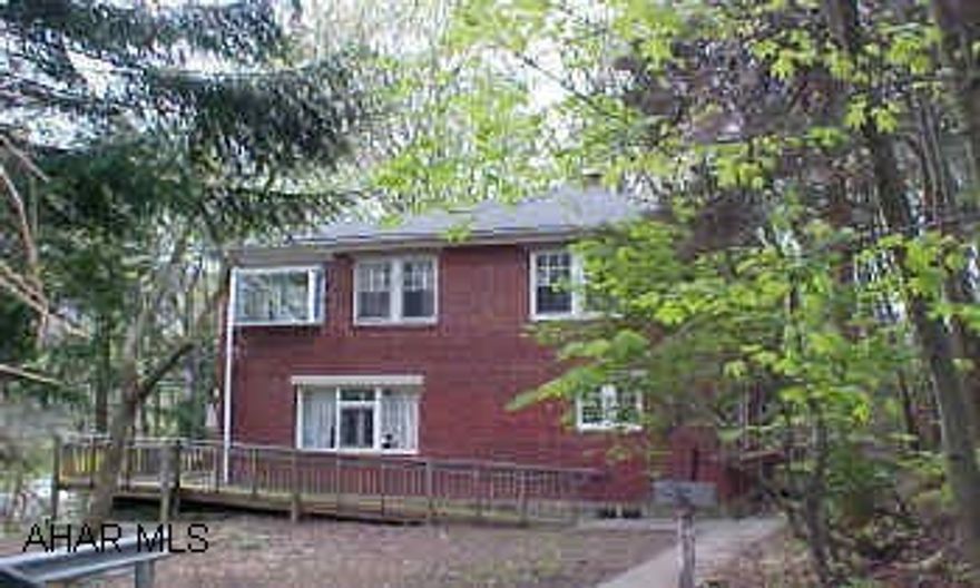 Stately brick home situated in Juliana Heights. Beautiful views of the Bedford Elks Golf Course. Large master bedroom with ceramic tile master bathroom. Home has lots of potential.