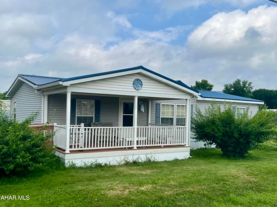 Attractive Double Wide on a large rented lot, featuring a spacious covered porch, 2 sheds and parking area. The rooms are bright and spacious with large kitchen and open floorplan. Newer metal Roof in 2017. Some new flooring, plumbing and refrigerator. Room to move both inside and outside!  Monthly Rent is $485