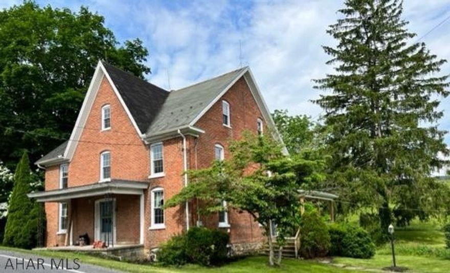 Beautiful brick home with 3 bedrooms with possibility of 4th, 1 1/2 bath, full basement, newer windows, updated waterproofing, walk up attic, large family room with woodstove, gorgeous plank floors, small stream, and 2 car detached garage/shed.