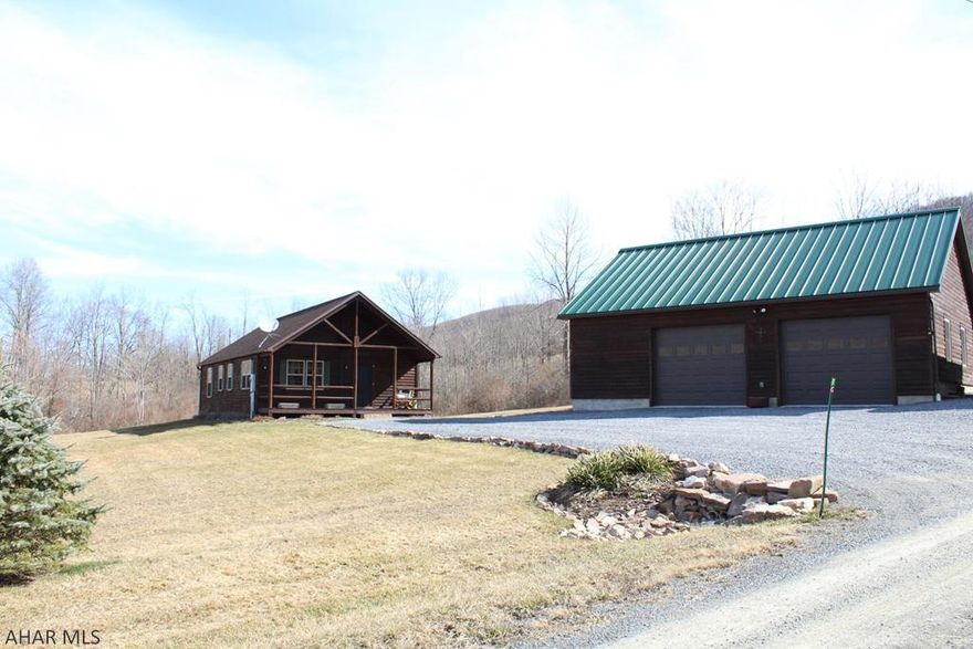 This gorgeous log home is situated within a relaxing mountain view and located near State Game Lands. The open field provides plenty of space for creating a small farmette or whatever else you can imagine. Huge 2-car  garage with loft area gives you plenty of storage space. This home features all wood floors and walls on the interior, the exterior logs were re-stained and re-sealed in 2020. Home is move in ready, all it needs is you!