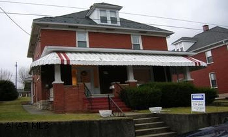 Solid brick 2.5 stry w/4 BR, 1.5 BA. Large living room, formal dining and eat-in kit.  First Floor laundry. New furnace, updated electric service.  Must see inside!! Nice home is the borough,some hardwood floors, heat in bsmt, stained glass window, large rooms. This propertyis in good condition.